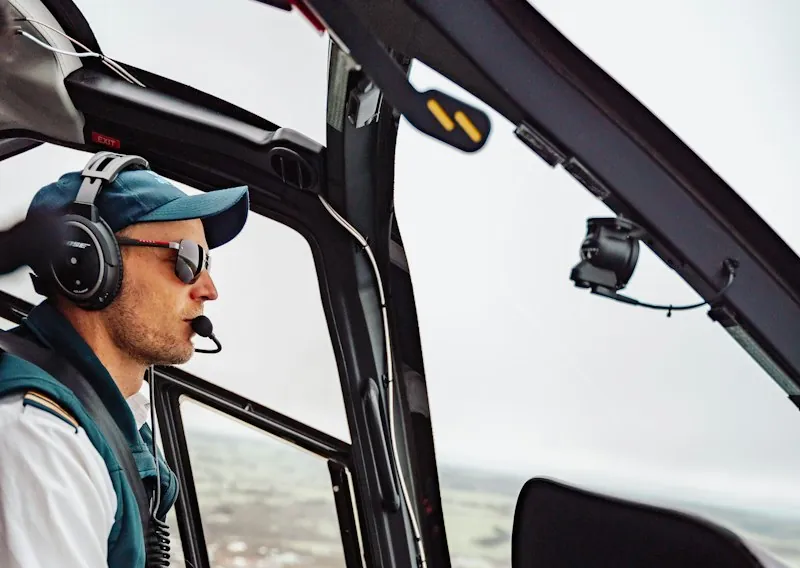 Helicopter pilot using an aviation radio headset